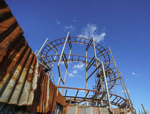 A rusty structure shaped like a rollercoaster