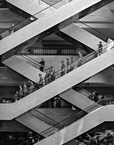 Escalators with people on